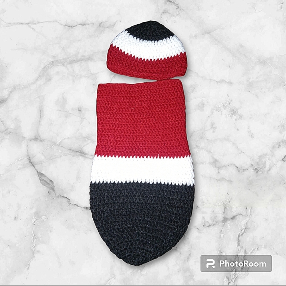 Red, white and black baby cocoon.